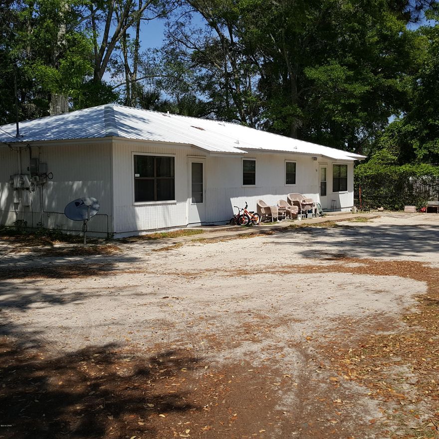Duplex with $1,100 gross monthly rent on over 1 acre of commercial land right off of Tyndall Parkway, a perfect place for your business! * New Roof June 2019* Each unit rents for $500 per month. Owner pays for W/S/G & street light. Mobile home  pays lot rent of $100 monthly. Water/sewer has been as low as $92.00 and as high as $176.00 a month. Usually around $120.00 a month. Garbage is $87.00 a quarter. Street light is $9.17 a month. Current commercial zoning does NOT allow for additional residential units.