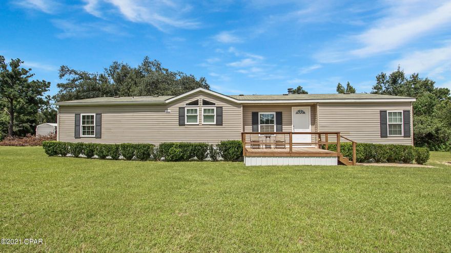 Well cared for home on 1.25 acres. Current owner replaced all of the floor throughout the home and refinished all of the wood work in the home after they purchased it almost 5 years ago. Above ground pool and storage shed with 2 lean to's convey. Upon entering the home you will see how well cared for it is. The kitchen cabinets were repainted. The large picture windows in the family room provide plenty of natural light. This property is less than a 1/2 mile from Round Lake and there is a small boat launch. The small family friendly area is very peaceful and relaxing just off of Hwy 231. Less than 45 minutes to Panama City and easy access to I10 (just 6.5 miles North on 231).