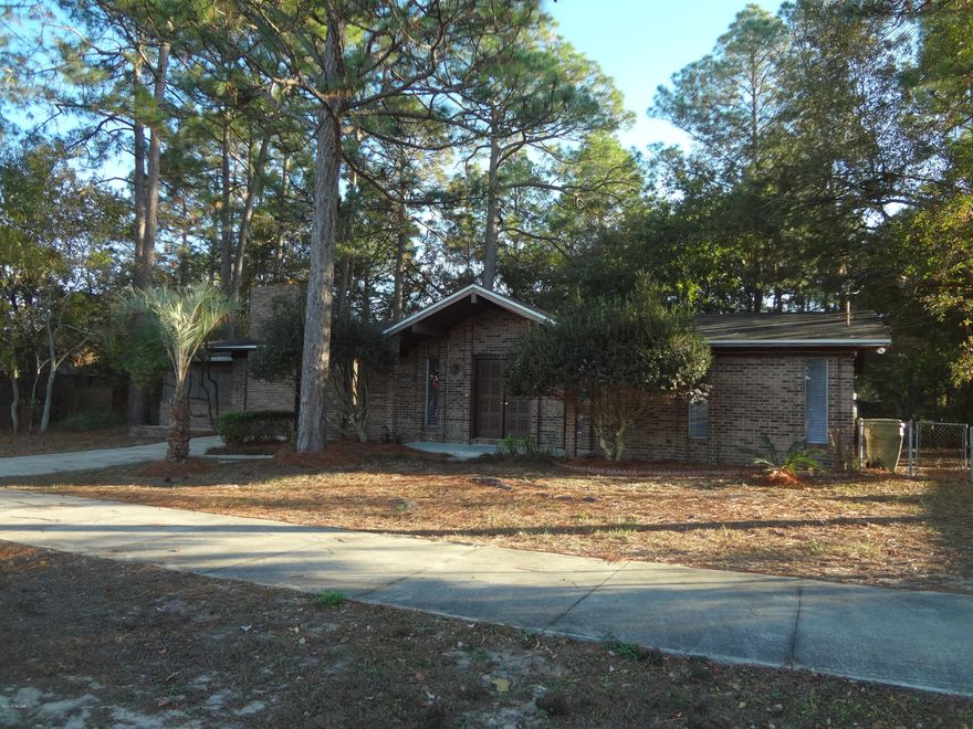 Conveniently located Lynn Haven home, near Mowat Middle School with easy access to Lynn Haven shopping areas.

This all brick home offers a large private back yard, huge screened in porch, three bedrooms, two baths along with two living rooms and a den with stone fireplace. Ready for immediate occupancy, call to see today!