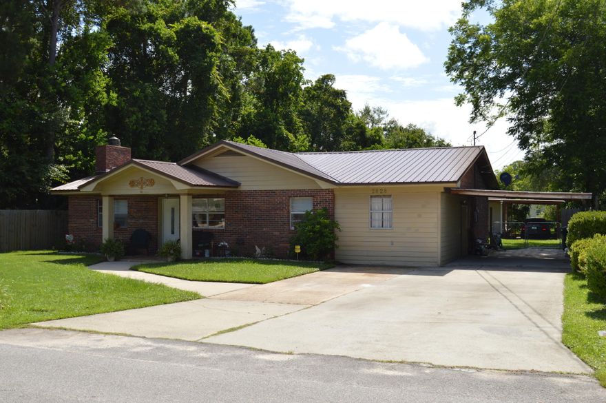 Stop!!! Don't miss out on this Beautiful 4 bedroom 2 Bath Home that may be perfect for entertaining. Home Features include Den with Fireplace Plus Living Room Plus an Office/Crafts Room/Man or Woman Cave. Plenty of room in this home for all your needs. Bathrooms have been renovated/upgraded, New Metal Roof,Back yard Completely Fenced in with Covered Front and Back Porches. This home has its own Detached Workshop with Electric Service and a Separate Covered Parking for the Boat/Small Camper/Spare Car. Call TODAY on this Amazing Home Before Someone Else Calls First. Immaculately Clean Homes with these upgrades don't normally last long!