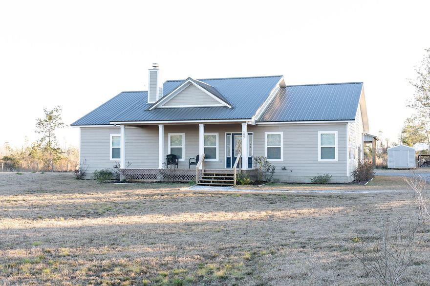 This amazing 3 BR 2 Bath custom built home sits on a fenced 1.25 acre lot. with a 24 x 36 pole barn.  This home has hard wood and porcelain tile throughout.  Includes Samsung Stainless steel kitchen appliances PLUS Maytag washer and dryer with MCT( Maytag Commercial Technology).  The  12 foot ceilings add to stunning character of this home. This home comes with a metal roof, Plumbing cutoff manifold, and spacious covered front and back porches and a WOOD BURNING FIREPLACE.  Conveniently located just moments from I-10 which would allow for easy commuting to work. MUST SEE!  Call today to schedule your showing of this magnificent  home.