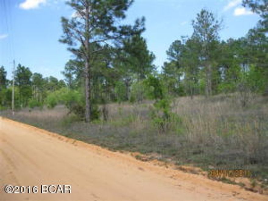 Rectangular 330' by 660' parcel of land fronting on Wild Rose Lane, a dead end road. Situated on high hill and land slopes from back to front with back of property capable of having a nice view and a good place for a homesite. Lot is not restricted, mobile homes are allowed. Wooded with pine trees and small oaks, but not densely wooded. No lowlands. Located approx 1 mile East of SR 77 S. of Wausau. BRING OFFERS! Owner anxious to sell.
