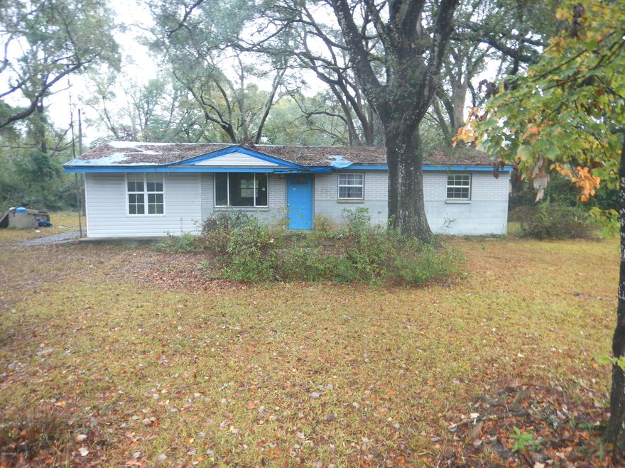 Handyman Special 3/1 home nestled on a 1 acre lot of beautifully wooded land. This 1,152 sq. ft. fixer upper features a spacious living room that opens up to the large eat-in kitchen with ample cabinet space and 3 nice sized bedrooms. All Information recorded in the MLS is intended to be accurate but cannot be guaranteed, buyer advised to verify. Sold As-Is. No utilities will be turned on to this property and only cash/renovation loan offers with 0 day inspection period will be considered. Buyer should perform their due diligence/necessary inspections before submitting an offer. SELLER DISCLOSES THAT THE MINERAL RIGHTS TO THE PROPERTY WERE RESERVED BY A PRIOR OWNER IN A SPECIAL WARRANTY DEED. PLEASE SEE ATTACHED CONTRACT REQUIREMENTS PERTAINING TO THE DISCLOSURE OF MINERAL RIGHTS.