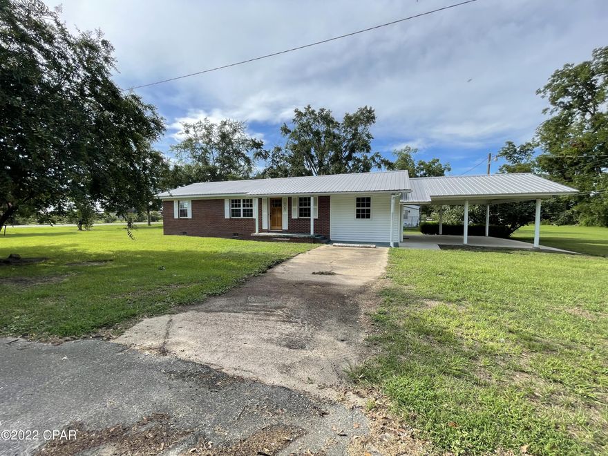 CURRENTLY UNDER CONTRACT, SELLER WILL CONSIDER BACKUP OFFERS.  Remodeled 2/1.5 with a two bay carport in the city of Malone. Home has been refinished beautifully, to include; new windows, paint, some flooring, (original hardwood floors have been stripped but not stained) appliances, counter tops, and more. This place has major curb appeal and all high price items already replaced including roof, HVAC, and water heater. Must see to appreciate!