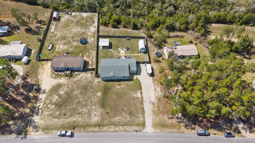 Welcome to peaceful country living in one of Southport's most sought-after neighborhoods! This beautifully maintained 2020 triple-wide home sits on ¾ of an acre and offers the perfect blend of space, comfort, and modern updates.
Inside, you'll find a spacious and thoughtfully designed floor plan featuring 4 bedrooms and 3 full bathrooms, including two private primary suites with en-suite baths handicap accessible with widen doors, making it ideal for multi-generational living, guests, or added privacy. The home feels bright and open with plenty of room to relax, entertain, and spread out.
Enjoy Florida living at its best with a covered front and large back porch, perfect for morning coffee, evening sunsets, or gathering with friends and family.
Step outside to a generous backyard where you'll find a cozy fire pit area and two detached sheds with electricity--ideal for a workshop, craft room, hobby space, or additional storage.

Located in a quiet, highly desirable Southport neighborhood this property offers the tranquility of country living while still being convenient to town.
With modern construction, ample outdoor space, and versatile outbuildings, this home truly has something for everyone.

Assumable mortgage at 3.25%!

Don't miss the opportunity to make this beautiful property your own!