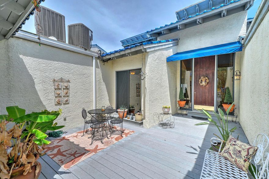 Rare find. Expansive water view of St. Andrews Bay from both floors of this two-story townhome. Dock your boat in your own deeded slip, or take a refreshing dip into the tiled, community pool. The gated entrance of this restful retreat leads to an interior courtyard adjacent to the front door. From the deck of your private patio on the bay you can entertain while enjoying the sight of dolphins, blue herons, or passing pelicans. The two-story foyer is both bright and inviting.  An updated kitchen separates the main living area from the den or office. The entire second floor is devoted to the master suite where you can sip coffee on another private deck while watching the sunrise spread across the bay. The master bath is generously sized with a double vanity, soaking tub, and separate shower along with his and her walk-in closets. Each slip comes with potable water and electricity, with the cost included in the community HOA dues. The boat slip for this unit comes with an electric lift in the private, protected marina on Woodlawn Bayou, located behind this 12-unit townhome complex. 
The Moorings is truly unique... unobstructed BIG water views across one of the widest spans of West Bay, ample green space on the Moorings grounds, a large pool and a private marina with your own private slip. It just doesn't get much better than this. Call to arrange you private showing today.