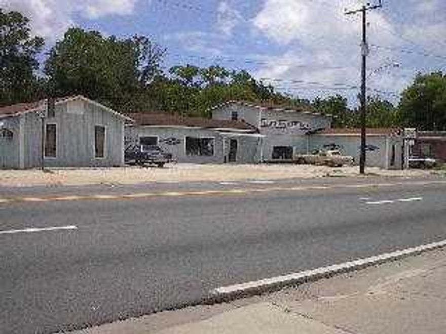 Over 5000 sq ft of commercial store area. This is a great investment opportunity.  The last owner took out all light fixtures and HAVC.  Needs repairs and remodeling.   **BRING ALL OFFERS**