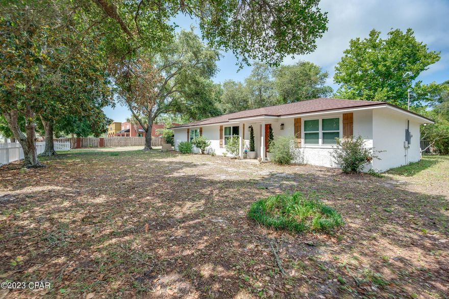 This property has sold! Discover similar listings by reaching out to us for an updated list of available properties that match your preferences. Sitting on over 1/2 acre, this charming 2BR/1BA house on the far west end of Panama City Beach has been heavily upgraded. Featuring a brand new HVAC, new insulated windows, new fencing, new flooring, a new tile shower, new septic system (2 years), new attic insulation, new exterior paint and and new roof (3 years), you can see why the owner loves to make this his home away from home. Located close to 30A, the Lake Powell boat launch, Pier Park and the beaches, this cute home is a fantastic buy. Make it a point to see this one today.