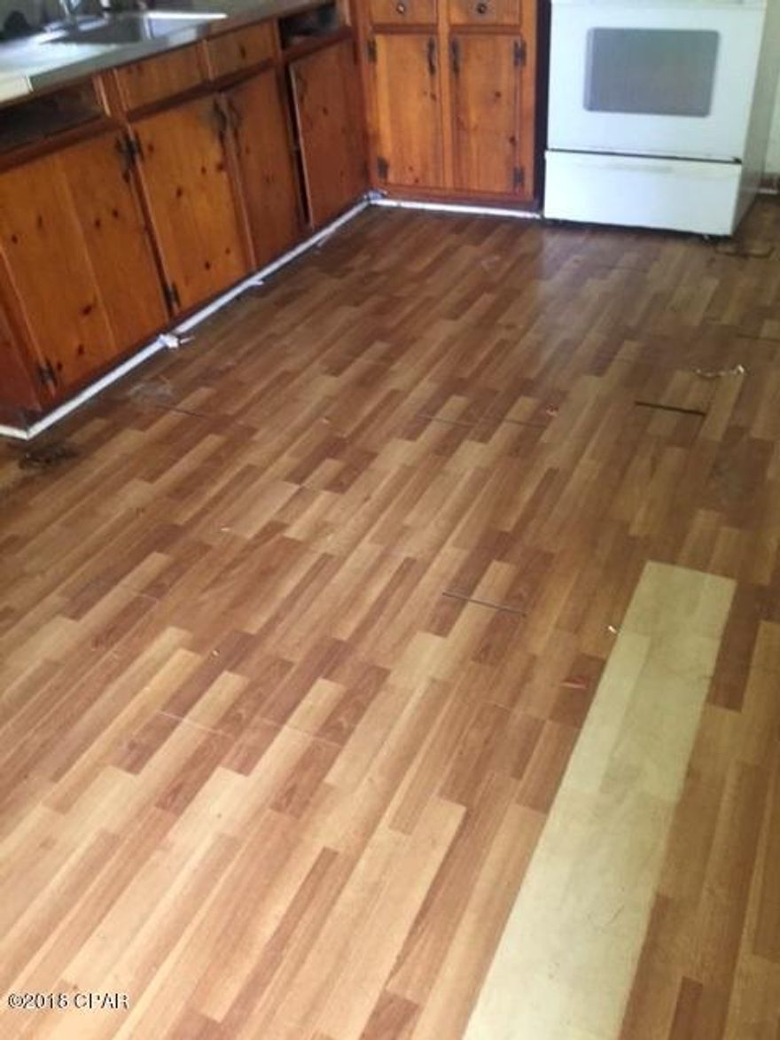 This home in in a great location for rental residential or commerical.  Nice wooden floors. Large yard and alley access.  Lots of potential just needs your handiwork to make this home even better.