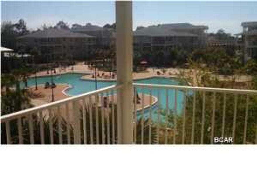 Experience an oasis at the beach. This is an executive 1 bedroom, 1 bath, 1069 sq. ft. condo with a study/office in the beautiful and tranquil gated community of Island Reserve, located off Front Beach Road in Panama City Beach. This open floorplan features hardwood flooring in the living area, tile in the kitchen and bathroom, and plush carpet in the bedroom and bonus study, all with 10' ceilings. The well appointed kitchen includes granite countertops and island, stainless steel appliances, and detailed cabinetry. Bonus amenities include washer and dryer, window coverings, private balcony and covered garage parking and entry. The Island Reserve community features gorgeous landscaped courtyards with paved walks and fountains. Club house boasts fitness center, media center,