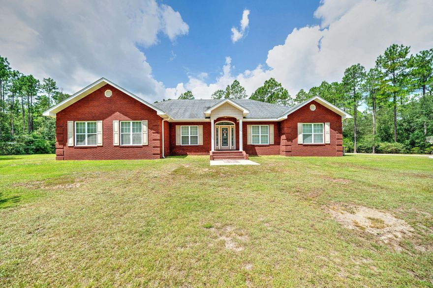 This exceptional home is nestled on a well manicured 22.77 acre parcel.  This gorgeous 3/3 home has been beautifully maintained.  Features include LVP floors in the main areas, tile in the  kitchen baths, and laundry. Carpet in the bedrooms. The Kitchen is an open concept with Stainless steel appliances, back splash, hard surface counter tops beautiful custom cabinets and large island with built in sink.  The Bedrooms are good sized with ample closet space. The Master is over sized and hosts  standalone shower double vanity and water closet. It has Jack and Jill attachment to the laundry room as well for convenience.  The huge bonus room features a separate office area, Stone Fireplace and elevated ceilings offering plenty of space for entertaining guests or family.  Outside the Parcel hosts not 1 but 2 ponds one is creek fed and the other is stocked with catfish and ready for the outdoors-man in the family. 
There is also a huge workshop and 24'x36' pole barn for the toys. There is a whole house generator which is run on Propane. The AC was replaced in 2019. 
Located just 3 miles outside of town. Off of a paved road, Close to schools, shops, etc. and only an hour from the world's most beautiful beaches.. 

You will not want to miss this one. 
Contact your agent today to schedule your private tour of this amazing home.