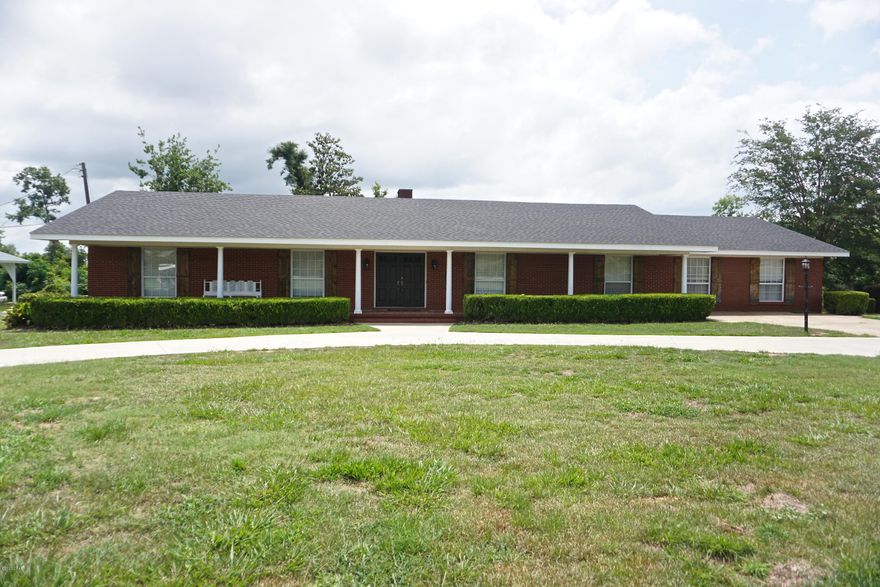 PROPERTY UNDER CONTRACT; SELLER WILL ENTERTAIN BACK UP OFFERS. Executive 4 bedroom home with pool and beautiful covered porches located near Marianna High School and the new K-8. This spacious home features a large kitchen with lots of cabinets, den with fireplace, formal living and dining area, and laundry room with more storage. Two of the bedrooms could be considered master bedrooms with en suite bathrooms, or one could be used as bonus room. The bedroom that is currently the master has a beautiful tiled walk-in shower, double vanity with tower for storage, and water closet.  The back covered back porch overlooks the saltwater, gunite pool and huge fenced in back yard and is the perfect space for grilling and entertaining. The roof was replaced in 2020, the HVAC units are only approximately 2-3 years old, the fire place has gas logs and there are two tankless hot water heaters. The front and back yard are nicely landscaped, the neighborhood is peaceful, and the large circular drive is perfect for children to bike or skate.