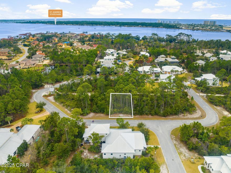 Residential lot available in the highly sought-after Martinique neighborhood. This gated community offers a range of amenities, including a pool, playground, pavilion, basketball court, and walking trails. Just beyond the gates, popular restaurants like Capt. Anderson's and The Grand Marlin are within walking distance. Lighthouse Marina and St. Andrews Park are only minutes away, providing easy access to outdoor adventures. Lot next to this one is also for sale.  A great opportunity to build your dream home and enjoy coastal living in Martinique.