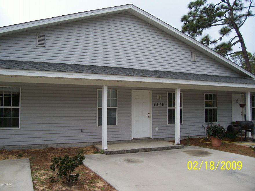 Great triplex 2 bedroom 2 bath unit with tiled dinging room, vaulted ceiling in living room, and open patio