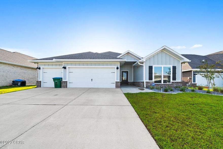This gorgeous 4 bedroom, 3 bath home is located in Titus Park. It features a 3 car garage. The master bedroom is located towards the back of the home. It has 2 walk-in closets, and the connected bath has a free-standing tub, a shower, water closet, and dual vanity sinks. It also has a door that goes out to the patio. The 2nd bedroom is in the middle of the home and features its own bathroom. The other two bedrooms are towards the front of the home with the guest bath in-between. A large living space is open to the kitchen and dining area. The kitchen has granite countertops and Whirlpool stainless steel appliances.