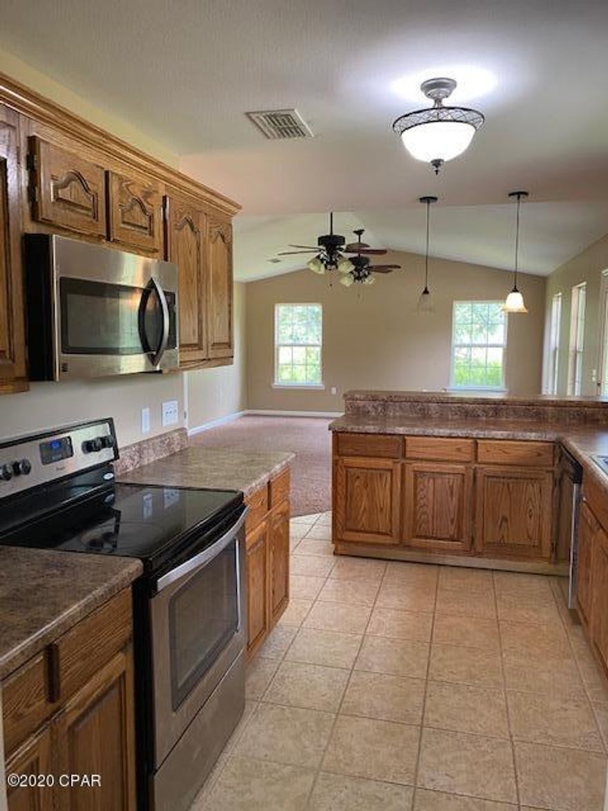 Cute 2 bedroom 2 bath home that is ready to be lived in.  It has spray foam insulation and standing seam metal roof.  Pull into the carport on the concrete driveway. The cathedral ceiling gives a homey spacial feeling.  The kitchen has solid oak cabinets. Very open and very clean.