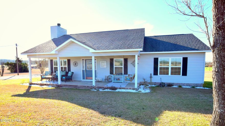 This craftsman style home was inspired by many of the trendiest designs with a farmhouse influence detected throughout! Step inside this 3-bedroom, 2 bath home and you are immediately greeted with beautiful vinyl plank flooring, vaulted ceilings with exposed wood beam, a custom stone fireplace surrounded by shiplap and the most adorable eat-in kitchen featuring butcher block counter tops. The master bedroom is complete with a walk-in closet and en suite bath. Enjoy the morning sunrise from your oversized front porch, or the sunset by the fire under the pergola. Other outside features include an attached carport and pole barn with closed in storage room. House sits on a 1 acre parcel located just off Alford Hwy close to Orange Hill Road.