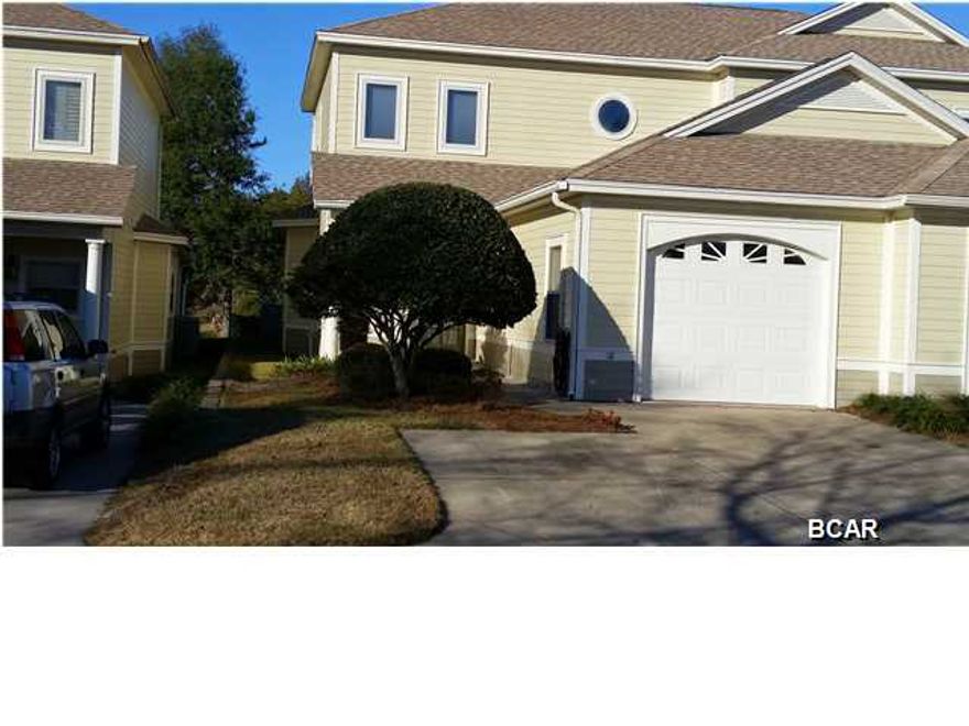 Well designed attached distinctive town home with top notch construction that is close to shopping, Panama City Beach and hospital. This 3 bedroom 2.5 bath town home has a large screened porch that overlooks private Hentz Lake and is a gated community. Amazing ducks and shore birds frequent the lake and nature views and quietness are so enjoyable. Master suite is on the ground level and has a large seating area. The master bathroom has double vanities, his and her large closets with custom shelving, whirlpool tub, and a new decorator tile shower. The foyer, kitchen and great room have beautiful oak floors and kitchen has top of the line cabinets, & solid surface counters. The laundry room has cabinets.  New A/C 2 yrs ago, high end dishwasher and screen porch is tiled. Wired with speakers. room. Upstairs loft room is ideal for a second living space, office, or reading room. There area an additional 2 bedrooms and a full bath on this level with lots of storage throughout the unit. The HVAC is high efficiency and was replaced recently. This is a most attractive complex and can't be equaled anywhere in town for location and quality.