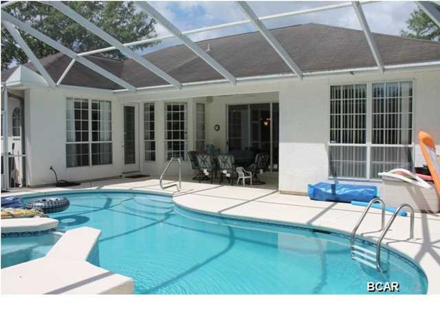 THIS LOVELY FLORIDA STYLE HOME AWAITS YOU if you're looking for a 4 bedroom 3 bath home with a screened in pool and lanai in The Mowat Highlands subdivision. The sellers have freshly painted the interior and replaced flooring in the dining room and two of the additional bedrooms with laminate wood flooring. This home is move-in ready so don't waste anymore time looking for the perfect home with a BEAUTIFUL POOL! The floor plan is split with the Master suite having his and hers closets, his and her vanities and a separate shower and Jacuzzi tub! You have plenty of room for entertainment with 2 different living areas, a formal dining area and a breakfast nook. The additional 3 bedrooms are all a nice size with 2 of the them between a shared bath and the 4th bedroom being at the back of