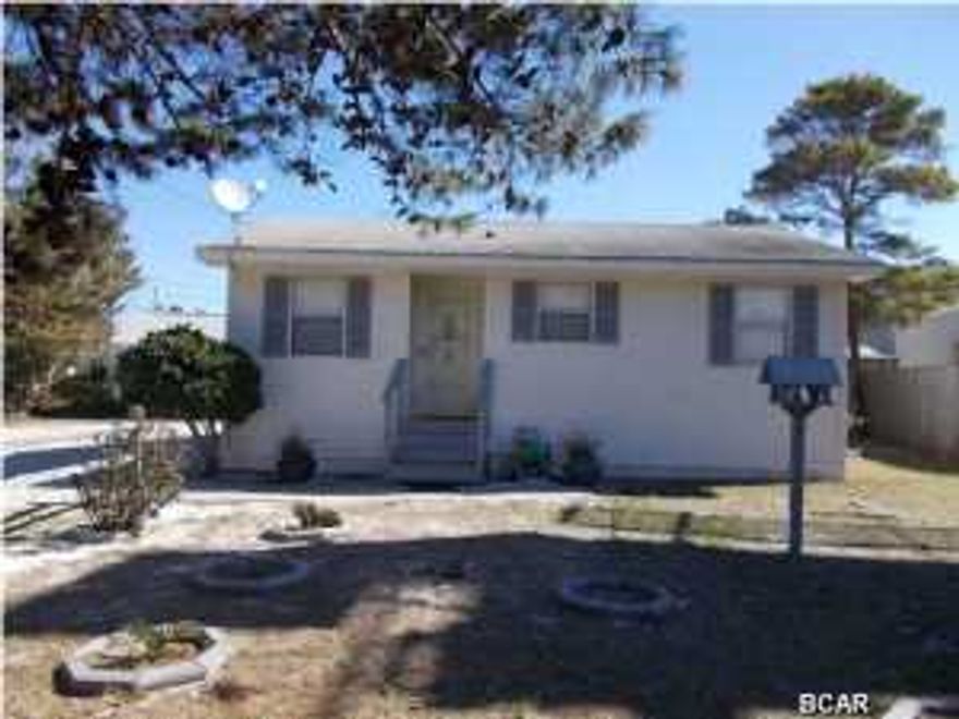 Don't miss out on a wonderful beach cottage or investment property. This home is in the very desirable West End of the beach. The home is a short walk to Lake Powell and the beautiful Gulf of Mexico. Close by is a Publix, Winn Dixie, Billy's Crab House, more shopping, not far from Pier Park, not much of a drive to 30A. You really have the best of both worlds. Home features an extra large gravel driveway, room for several large vehicles, boat, RV. it's 30x100 lots of room. A new covered porch, place to enjoy the quiet evenings. Yard has an 8' privacy fence in back. A workshop/ with power or make great storage also insulated. There is a boat ramp at Lake Powell, you can also go over to the beach from there on the Lake. Inside of home shows very well. Ready to move in. Wonderful first
