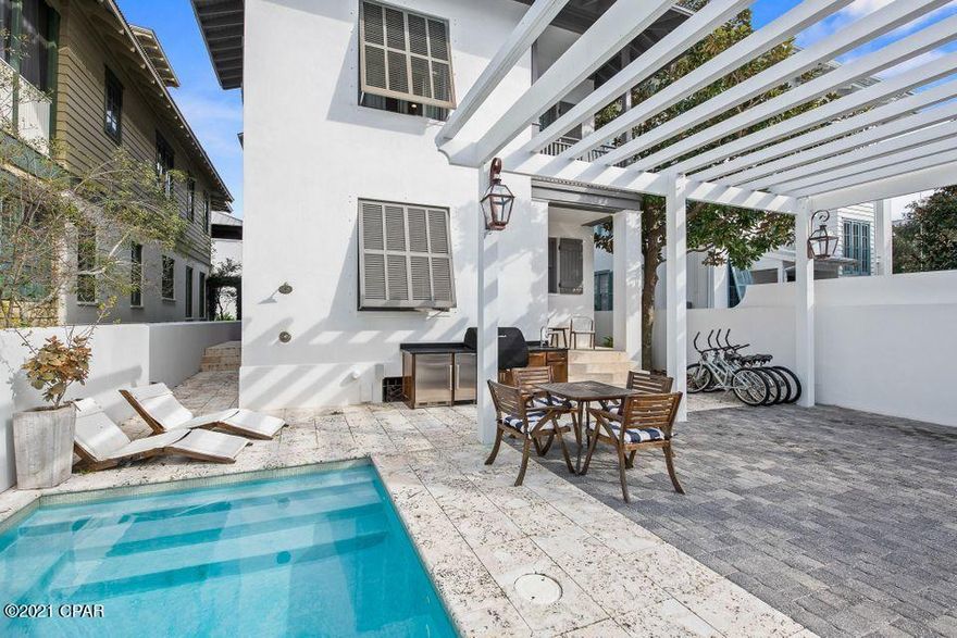 Poised just four tiers from the beach on Rosemary's Gulf side, this exquisite custom home with private pool boasts a highly coveted location just 100 steps to both the beach and Rosemary's lively Town Center with all of its amenities, restaurants, and shopping. ''Rosemary Bluegrass'' was renovated from the ground up in 2017 by renowned custom home builder Matt Fuller and interior design firm Kay Fuller and Sons, using impeccable finishes that exude a high-design beach house with crisp coastal elements. Elegantly constructed with attention to every detail, the home has jaw-dropping finishes utilizing reclaimed barn-wood from the Bluegrass Country of Kentucky...



Hand-hewn beams adorn the vaulted ceiling in the living area and master bedroom. Other accents include vintage oak flooring & do