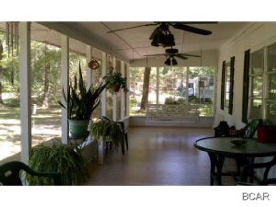 Looking for the PERFECT fishcamp! You will LOVE Howard Creek! This quaint golf cart community sits between Wewahitchika and Port St. Joe and has some of the best fishing in Florida, easily accessable to Apalachicola River and Lake Wimako. This home is a modified mobile home, but don't let that scare you off.. it is very clean and well kept with lots of vintage charm. You will love relaxing after a day of fishing in your porch-swing on the huge screened porch overlooking the beautiful yards. Lot is fully fenced. Home features a deep well and concrete septic and has just had all electric updated. Check out the additional photos to get a feel for this great camp located just around the corner from the boat landing with its RV park, and country store!