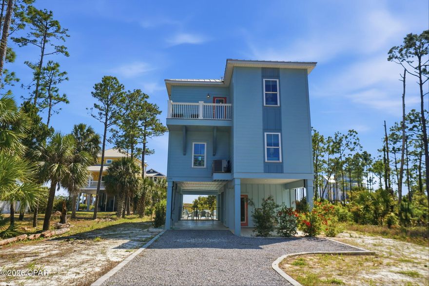 Welcome to a recently constructed coastal retreat where sweeping Gulf views greet you from both the first- and second-floor balconies, setting the tone for a true beachside escape just a short walk to the beach. Nestled in the laid-back, golf cart- and pet-friendly community of Indian Pass, this beautifully designed 4-bedroom, 4-bath home features two spacious primary King suites, each with its own Gulf-facing deck and en-suite bathroom complete with tiled showers and double vanities, creating a serene space. The property also has a 5' private deeded access to the gulf and a lagoon parcel across the street for added water access. Large bunk suite with two twin-over-twin bunks provides a fun and functional space, while a fourth bedroom with two full beds is conveniently located near a shared bath. The top floor serves as the heart of the home, where an open-concept great room showcases expansive Gulf views, a comfortable living area, and a well-appointed kitchen with stainless steel appliances, a wet bar, and ample dining space for everyone to gather. Designed with both relaxation and recreation in mind, the property offers a private pool with optional heating, a large deck overlooking the Gulf, and outdoor amenities that enhance the coastal lifestyle, including a gas grill, outdoor shower, and fish cleaning station. The ground level also features a commercial-grade ice maker, an additional refrigerator, and parking for multiple vehicles. An elevator provides convenient access to all floors. Located in the peaceful and scenic Indian Pass area, this home places you just moments from uncrowded beaches, the historic Indian Pass Raw Bar, and the charming coastal communities of Port St. Joe and Apalachicola, where you'll find local dining, shopping, and Old Florida charm. This property offers the ideal blend of comfort, space, and location for an amazing Gulf Coast getaway. Some dimensions taken from the Gulf County Property Appraiser's website, verify if important.