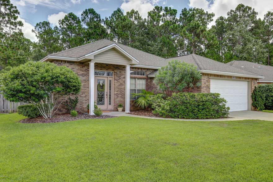 Nice all brick home located at end of cul-de-sac with many custom upgrade. There are 2 seperate living areas. Beautiful wood look floors in the formal living area and a fireplace. Kitchen has solid surface stone countertops, stainless steel appliances and large breakfast bar. There is a split bedroom floor plan, crown molding, formal dining area, tray ceiling in master bedroom, extra large laundry room with custom cabinetry,surround sound, extra windows and double French doors leading to screened in patio, back yard large enough for pool & features wooded area bordering back of property which offers extra privacy; convenient location for families.