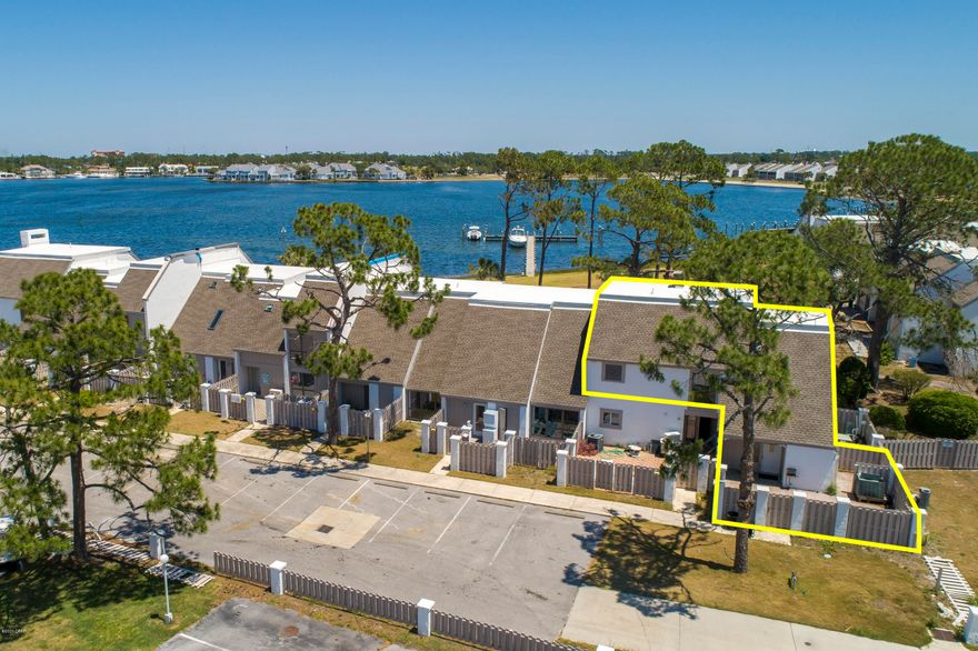 Only Turtlegrass listing! Turtlegrass is a much sought after community within Bay Point. Known for its location overlooking Grand Lagoon & the Bay Point Marina as well as only minutes to access to the Gulf of Mexico or Shell Island. This unit has much to offer than others due to it has extended pavers that provide a place to park your golf cart within the fence and still have plenty of room for grilling and guest entertainment. You will have 2 Master bedrooms and baths, all living area is upstairs & the Laundry room is downstairs. You can choose how you want your dream kitchen, living room, and dining room, as it is only a shell at this time. Make this your dream vacation spot & enjoy all it has to offer, which offers 3 boat docks.