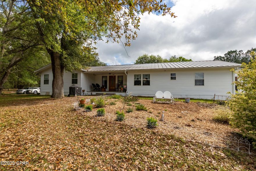 Surrounded by captivating views, this remarkable completely fenced 10+ acre 3 bedroom 2 bath home is situated in a tranquil setting, perfect for those desiring privacy.  Home offers a split floor plan, natural lighting in every room, generous size bedrooms, stunning living room with vaulted ceilings, Brazilian cherry hardwoods, new windows, beadboard, crown molding and amazing wood work trim throughout the home and so much more.  The kitchen opens to the dining and living room making it very open, offering custom cabinetry, plenty of cabinet and counter space, ideal for hosting family gatherings.  Grab a book and enjoy reading in the spacious den.  In addition there is a large laundry room with so many cabinets, there will be a place for everything.  The sunroom is amazing offering a view of the property, such a peaceful haven.  Out buildings include the 24x48 barn, 8x12 feed room, 4x8 pump house (gas/propane generator will convey) 24x24 hay barn, pole barn with a concrete slab, 36x24 shop with a 20x24 concrete pad. There are 2 heat pumps first replaced 7/2019 and second replaced 3/2020.  Pride in ownership shows in all areas of this property.  Call for your private showing today.