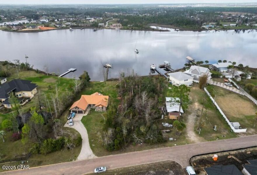 Waterfront lot with Gulf Access that's located on a brick road!  This lot is located on deep water and there's room for you to build your private dock on Cook Bayou.  You can be in East Bay for fishing in minutes.  Shell Island and the Gulf are a boat ride away.  Imagine building your dream home overlooking water and being able to have access to the Gulf by Boat!  This lot is waiting for you!