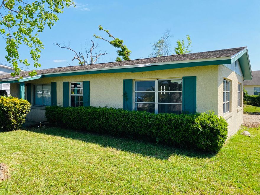 Great Location!! This home is ready to go back together!, with block exterior on a nice high and dry lot this would make a fantastic investment! This home has a brand new septic tank & drain field, city water, slab foundation and a nice car port that could be closed in as a 1 car garage or more living space. This home features a very nice first and second family room with lots of natural light, 3 bedrooms, 2 full bathrooms and a very large master that  can easily accommodate the addition of a large walk in closet or an office area. The kitchen is centrally located with plenty of room for lots of cabinets and counter space,  the laundry room is enclosed,  There is a bonus room that can easily be turned into a 4th bedroom or office. don't miss this investment opportunity! call today!