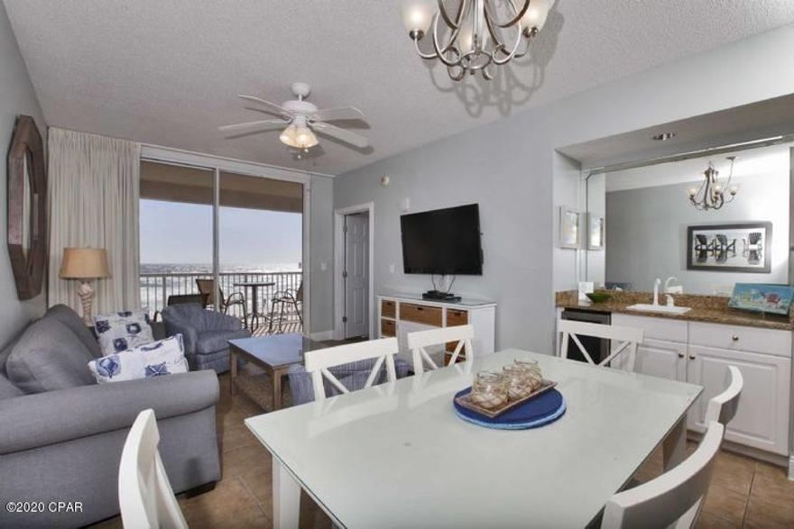 This one of a kind property conjures up images of sun-splashed days of swimming, biking, and relaxing. It lives like a beach house but comes with all the benefits of owning a condo. Hard surface flooring throughout and conveys with luxurious furnishings, window treatments, and artwork that welcome you to lie back, relax, and enjoy panoramic views of the pool, beach and ocean. Open floorplan and 9' ceilings allow for fabulous Gulf and sunset views from balcony, living room, dining room, kitchen, & master suite providing the ultimate alfresco living and entertaining environment! Sunset views from the generous, private, balcony are a perfect end to a sunny day and beginning to an exciting evening. MAIN MASTER SUITE is front and center on the beach with direct access to the main balcony and private bath complete with garden tub, separate shower, and large walk-in closet. The master suite opens from a glass slider door to a covered balcony. LUXURY! COMFORT! CONVENIENCE! Can be configured to sleep up to 10 people! EXCELLENT RENTAL INCOME POTENTIAL. Enjoy the good life at Majestic Beach with an unparalleled deck of resort style amenities including: 650 linear feet of sugar white GULF FRONTAGE, Four Large outdoor pools (2 at Tower I and 2 at Tower II), Two Indoor heated pools (one in Tower I and one in Tower II), Two hot tubs, Baby pool, Wading pool with waterfall, H20 Bar and Grill serving Gulfside/Poolside lunch and dinner, Large outdoor dining area, State of the Art Fitness center with steam room and sauna, 130 seat Stadium seating Movie Theatre, Convention center, Private Owner's Lounge with full Kitchen, Tennis Courts, Majestic Market featuring Starbucks coffee. Quick distance to the wonderful shopping, dining and entertainment at Pier Park. FROM THIS CONDO, YOU ARE WITHIN STEPS OF EVERYTHING YOU COULD EVER WANT AT THE BEACH! *Artwork in living room does not convey - see Realtor Remarks for details.