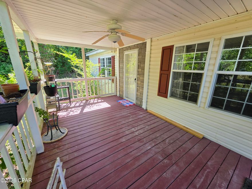 Well maintained double wide mobile home on nearly 1 acre in Sneads, FL! This lovely home is only 2 miles away from Three Rivers State Park, a short drive to Seminole Lake, about a 20-minute drive to the Marianna Wal-Mart, and i-10 is only about 10 min away. You can experience quiet country living while still being conveniently close to everything you need. The backyard is stocked with a banana tree, peach tree, blueberry and blackberry bushes, orange tree, and more!