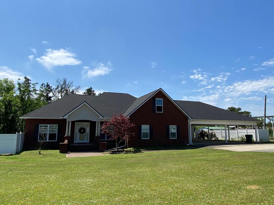 CURRENTLY UNDER CONTRACT, SELLER ACCEPTING BACKUP OFFERS  Wow!!  Check out this large executive home in a great location!  This waterfront property is a 4/3 home plus a 2/1 apartment over a home business that has endless possibilities!!  Walk in the front foyer to 11' ceilings & beautiful crown molding that opens to the formal dining room.  The living room has a wood burning fireplace and is open to the kitchen.  The kitchen has solid surface counter tops, stainless appliances & a breakfast area.  The master suite has a sitting area, walk-in closet & a large custom tile shower.  The other 2 downstairs bedrooms have walk-in closets!  Upstairs you'll find the 4th bedroom, full bath & a bonus room with a kitchenette that could be a 5th bedroom. There's also a 22x17 laundry/storage area that could be converted to a bedroom, family room, etc.  There's approximately 3,300 square feet in the main home with the rest of the square footage in the home business & apartment. 
 The home business & furnished apartment are connected to the home by the 4 car carport.  The home business has a full bath, kitchenette and is currently set up as a dog grooming shop.  Enjoy your morning cup of coffee on the large covered back porch overlooking the pond!  There's also a deck attached to the home business plus an upstairs deck attached to the apartment.  Chain link fenced backyard.  There's a storage building and a storage room under the home.  The home is located close to the new K-8 school, Marianna High School, Dayspring Christian Academy, Chipola College, Citizens Lodge, FCI and many other amenities.  New roof in 2019.  You've got to see this place!!!  Call your favorite Realtor to schedule an appointment!