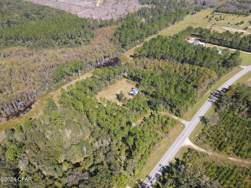 20 +/-  acres in Holmes County, Florida. Located right off of Bonifay Gritney Road sits a prime recreational tract of land that's ready for its new owners. This is a great opportunity to purchase an affordable piece of vacant land with features that are ideal for building your dream home, and also providing the perfect topography for deer and duck hunting. 

**Key Features:** 
- Cleared and leveled homesite location.
- Newly constructed pole barn. 
- Established power pole.
- Locked gate for privacy & security.  
- Paved highway frontage.  
- Roads/Trails: ATV trail runs up the East side of the property to hunting stand.
- Recreational Paradise: Abundant wildlife, including whitetail deer, ducks, and turkeys, offering excellent hunting opportunities.
- Location: 3 miles to Bonifay, FL, 49 miles to Panama City Beach, FL, 42 miles to Enterprise, Alabama.

**Investment Potential:** 
- This 20 acre parcel has harvestable pine trees and hardwood. 

**Recreational Oasis:** 
Embrace the tranquility of your own sanctuary amongst nature. Whether it's hunting for whitetail deer, whistling wood ducks, observing wildlife, or simply enjoying the peaceful surroundings, this property provides a perfect escape.   

**Opportunity Awaits:** 
- Ideal for those seeking both recreation and long-term investment. 
- Well-suited for hunters looking for a weekend getaway. 
- A great location right off of a paved highway. 
- No current survey.
- Boundary lines in photos are approximate and should be verified by the buyer.