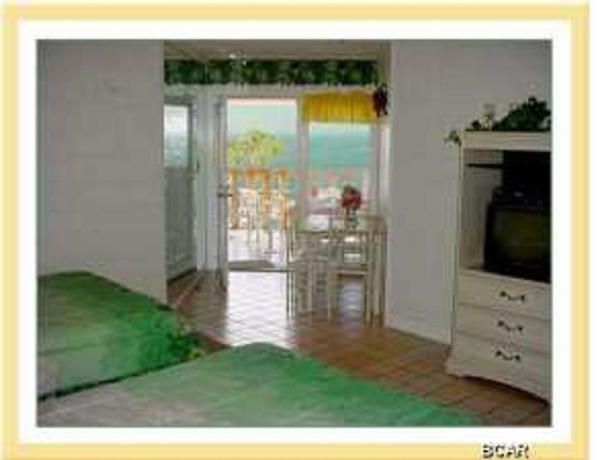 This is a Wonderful chance to have a Gulf front property at a reasonable price! The sand is just as white, the seas just as blue as the most expensive real estate on the beach! This unit has been freshly painted. But here you get less density and more sand for yourself! Sit back and enjoy the money you saved! This property is legally structured as a ''cooperative.'' This is a low rise project with only two stories! Enjoy the pool, shuffle board, or just grill out on the balcony. Don't feel like cooking at home? Pier Park is just 200 yards to the west! This structure was a motel, converted to Cooperative form of legal arrangement, consists of a 360 Sq. Ft. efficiency unit, with kitchen area and bathroom, know on site as room 206. (They did not use legal unit numbers) (NOTE: there is a