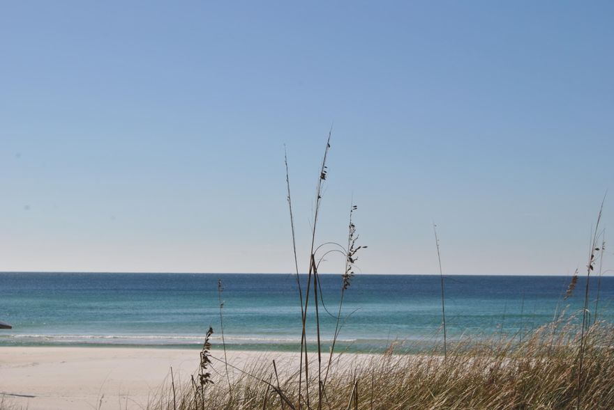 Beautiful, two bedroom unit on the first floor at Endless Summer...just a short walk across the street to the World's Most Beautiful Beaches...completely furnished and move-in ready.  Stainless appliances, sofa sleeper, ceiling fans...this unit will accommodate six adults...the amenities at Endless Summer are exceptional...one of the best buys on the beach:)