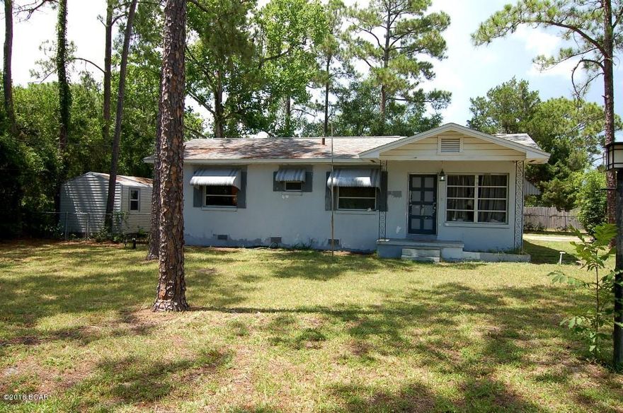 Great 5 bedroom fixer-upper. Perfect Investment or Rental Property. Two kitchens. Great corner lot located across from North Bay Haven Charter Academy. Fenced back yard; good lighted shed. New Lennox a/c system & air handler.  All interior rooms freshly painted. New tile floors in both kitchens, dining areas, and 2 bedrooms. You can complete renovations to suit your taste. Owner is an inactive real estate agent. Property being ''Sold As Is''.