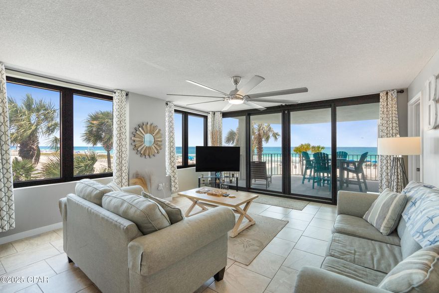 This is one of the most desirable units at Watercrest: a second-floor east-end condo that combines rare location, generous square footage, and unbeatable views. Skip the elevator and step right onto the sand or pool - this prime low-floor location makes beach days effortless and is popular with rentals. Inside, the spacious layout offers larger rooms than most 2-bedroom condos, and the end-unit positioning brings in extra windows that flood the space with natural light and stunning Gulf views from every angle. Sliding doors lead to an oversized corner balcony - one of the largest you'll find in Panama City Beach- with panoramic south and east views. The Gulf-front master suite with king bed also opens to the balcony, while the second bedroom fits two queen beds. The kitchen has been upgraded with oak cabinetry, granite countertops, stainless steel appliances, a newer sink and faucet, and a bar-height counter perfect for casual dining. Both bathrooms have also been updated with new cabinets and vanities, and tile runs throughout the living area, hallway, kitchen, and bathrooms. A separate laundry area provides a full-sized washer and dryer plus extra storage space. Sold fully furnished, the unit sleeps eight and is rental-ready. The unit's front door was replaced in 2024. Watercrest recently completed a $4.5 million renovation, including a new roof, windows, balcony doors, exterior paint, deck surfacing, and pool improvements - everything feels fresh and beautifully maintained. The well-managed HOA includes cable TV, internet, and a portion of the HVAC expenses in the monthly fees. Enjoy resort-style amenities like a heated pool, hot tubs, a kiddie pool, a poolside tiki bar, tennis, pickleball, racquetball, a fitness center, saunas, BBQ grills, an owner's lounge, beach rental service, covered parking, and 24/7 security. Tucked  away on the quiet end of Panama City Beach near Schooners and St. Andrews State Park, this unit is a rare find with serious income potential. Don't miss your chance - schedule a private showing today!