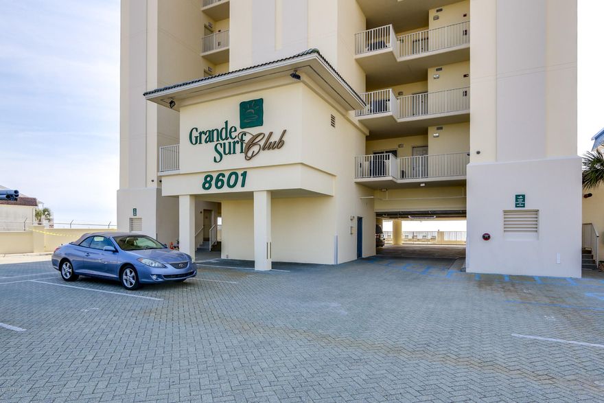 Located directly on the “World’s Most Beautiful Beach”, Grand Surf Club is a small, gated community that offers what most other condos along the beach can’t… PRIVACY!!  With only 2 units per floor, 26 in the entire building, you can relax & enjoy the beach or time at the gulf front pool away from the crowds. 9E is a beautifully decorated, meticulously maintained & will surpass all your expectations. The massive balcony not only allows for everyone to gather & enjoy the view, it also offers a natural gas connection allowing the grill master to show off his skills without having to leave the party. A large living room with a floor to ceiling windows allows the view to come inside. A gulf front master suite allows you to wake up in the morning to the all the beauty the area has to o Add to all this a large kitchen complete with island, large pantry, breakfast bar, 2 additional bedrooms and 2 full baths, a gas fireplace, 9' ceilings, large laundry room, tons of storage, crown molding, like new furnishings and drapes and you have what everyone is looking for... the perfect beach retreat. This unit is unique in that it also includes an assigned, covered parking space.

As for the complex, it sits on a low traffic street just off the newly redesigned section of Thomas Drive which is now a beautiful boulevard with palm trees and sidewalks.  

Grand Surf Club is gated community with secured access to the parking lot as well as secured access to the elevators.  The building has the feel of a non-rental building although short terms rentals are allowed.  However, 9E has never been rented which is evident by the perfect condition of the unit.

To truly appreciate all that this unit has to offer, check out the interactive tour to take a stroll around the unit.  And then call to arrange your private showing.  I promise... you won't be disappointed.