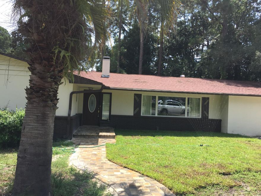 Temporary Price Reduction! This home has been freshly renovated and ready for a new family to call it home!  LOTS of space in this home, and LOTS of ways to accommodate your large family.  Home has 3 bedrooms and 2 baths with huge family room, dining room, and separate breakfast area off the totally renovated Kitchen - Kitchen boasts new cabinets, new stainless appliances, beautiful custom travertine countertops and glass tile backsplash with an island and LOTS of counter-space.  Flooring is tile and wood, also newly installed. Home also features a fabulous stone fireplace. 4th bedroom for a mother-in law suite or separate living quarters with it's own half bath, separate living area and beautiful glass doors leading out to the custom fire pit in the huge back yard. See additional pics