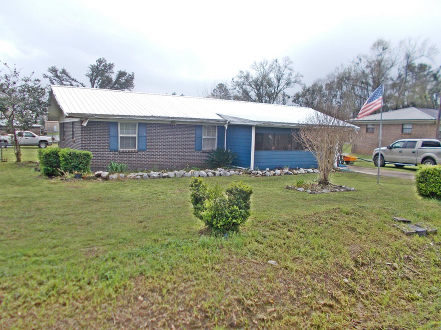 Cute brick home in the city limits of Sneads, it has some hurricane damage from the storm but is being sold cheap enough so the buyer could repair and have a nice home or make a rental unit out of it. It has a metal roof, the kitchen,plumbing, bathroom,a/c unit has been update in the last few years, they are living in the home so please contact me to view the home.