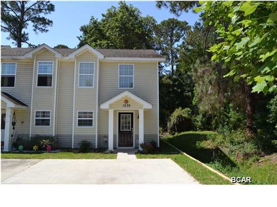 Completely renovated, end unit townhouse with 2 bedrooms and 1.5 baths. This home is better than new with tiled floors throughout the first floor in the great room, dining area and kitchen. The kitchen has like-new cabinets, new granite counter tops and a brand new stainless appliance package. A half bath is on the main floor also. The second floor has both bedrooms with the master being the larger of the two bedrooms. The main bath is also attached to the master with access to the hallway for shared use. A powder room with a vanity and sink is private to the master bedroom. The exterior of the home is vinyl for ease of maintenance and the back yard is fenced in for privacy. Come see this like new home today and live within a short walk to St Andrews Bay and all of the downtown  amenities. CALL TODAY