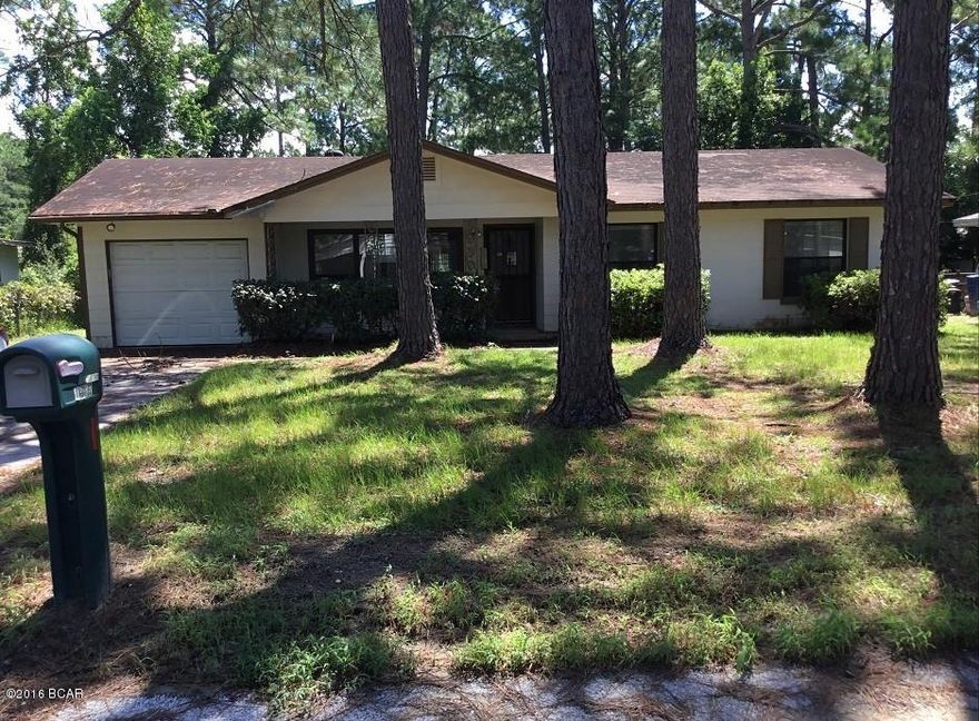 Ranch style 2BR/2B home being sold ''AS IS''. Brick home with shingle roof, screen porch and an attached one car garage. Living room and bedrooms are carpeted. Lot size .25 Acre +/-. Storage building in back yard.