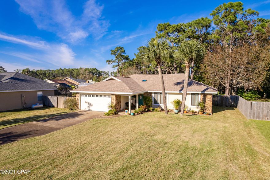 Beautiful, well-kept home approximately one mile to the sugary, white sands of the Gulf. Minutes from entertainment, restaurants, & stores! This home has a covered entryway, beautiful French doors, a wet bar, and an amazing Florida room! You will have complete privacy in the fenced in backyard, which has a pad already wired for a Hot Tub! New roof in 2018, new HVAC in 2020, new hot water heater and whole house Air Purifier in 2021! The electrical box has been updated as well. This one-story home on a large lot in the peaceful Grand Lagoon Shores community is a rare find! This one will not last long! Please call today for a showing! Please verify all measurements and information.