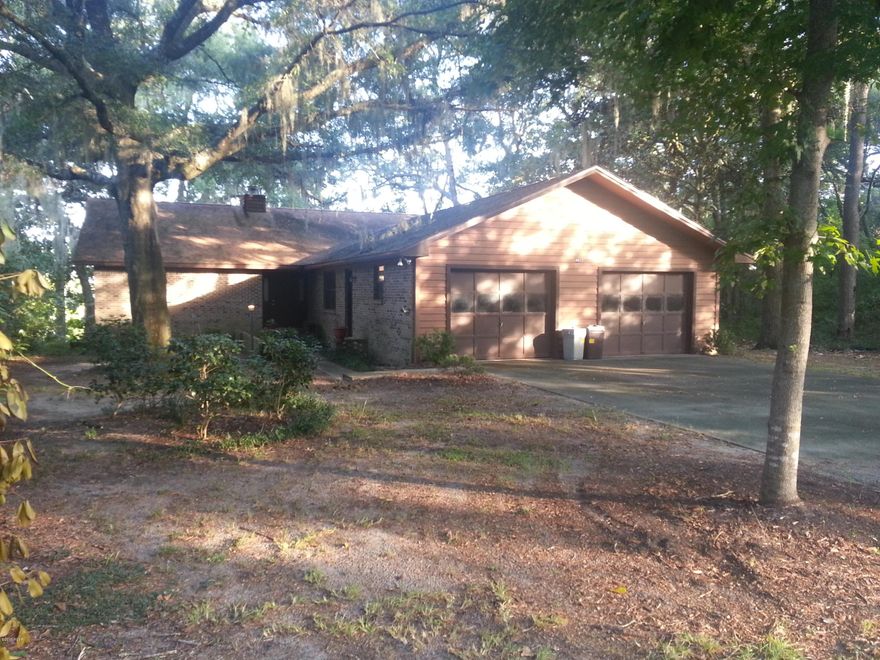 This is an opportunity of lake living that can not be passed up.  This split floor plan 3 bedroom 2 bath all brick, lake front home features a perfectly sized yard, a dock with water lines ran, deck of the Florida room; perfect for entertaining. The living room has a cozy stone fireplace and a beautiful view with huge window and glass door. The kitchen has lots of cabinet space and features a breakfast area near window overlooking lake and a formal dining.  Master bedroom has huge walk-in that also accesses to bath room, which has two separate vanities, stand-up shower and garden tub. There is also access to FL room from master as well as kitchen. Fl room has stained wood floor and small bar area. The laundry room has plenty of room.  Big drive-way, 2 car garage