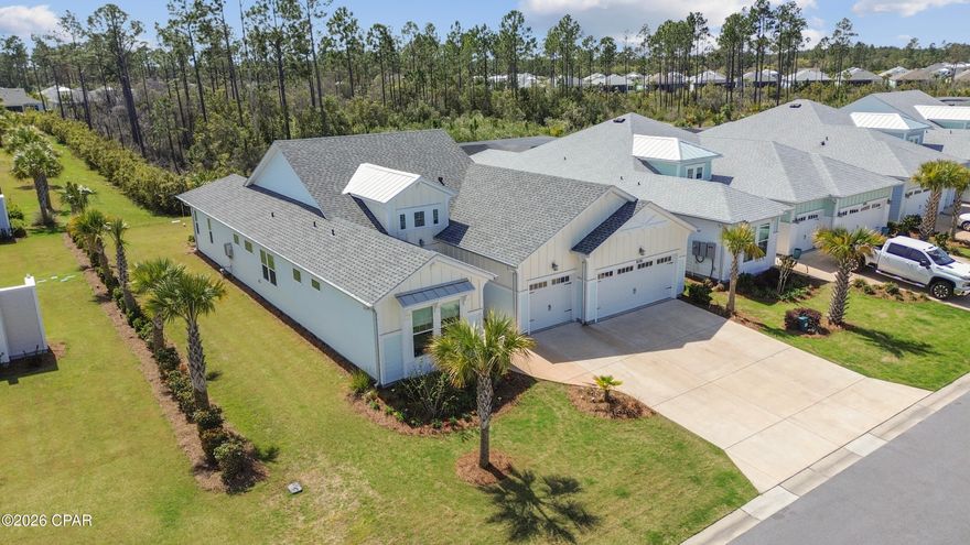 Significant price improvement! Seller offering some incredible incentives: $5K toward buyer closing cost, $10K toward closing cost for Veteran or Healthcare workers. Polywood outdoor furniture to remain ($15K value).

Welcome to this exceptional Trinidad Bay home in sought-after Phase 4 of Latitude Margaritaville Watersound, ideally situated on a beautiful private preserve lot along a quiet street comprised exclusively of Island Collection homes. This stunning residence offers thoughtfully designed spaces, extensive post-closing upgrades, and effortless indoor-outdoor living.

Step inside through a soaring two-story foyer highlighted by a custom coastal-inspired feature wall that sets the tone for the elegant finishes found throughout the home.

The heart of the home is the gourmet kitchen, designed for both everyday living and entertaining, featuring upgraded cabinetry, quartz countertops, custom tile backsplash, designer range hood, wall oven and microwave, and an oversized island perfect for gatherings.

The open concept layout flows seamlessly into a spacious dining room with a striking electric fireplace and custom accent wall, while the expansive living room boasts soaring cathedral ceilings and a dramatic wall of sliding glass doors that connect the interior to the outdoor living space.

A private den/office offers additional versatility and features a custom built-in bar with cabinetry and wine cooler, perfect for entertaining guests.

The luxurious primary suite offers a relaxing retreat with a spa-inspired bath and custom closets, while two additional guest bedrooms each feature their own en-suite baths, providing comfort and privacy for visitors.

The custom-designed laundry room is truly exceptional, featuring abundant cabinetry, a laundry sink, a built-in butler's pantry, and an additional refrigerator.

Enjoy Florida living on the extended screened lanai overlooking the peaceful preserve, the perfect setting for sunset views and evening cocktails. Outdoor furniture may convey with an acceptable offer.

Additional highlights include:

• 3-car garage with high-quality workshop

• RevWood by Mohawk laminate flooring throughout main living areas

• Casablanca ceiling fans and designer lighting throughout

• Electronic remote shades

• Custom feature walls in foyer and dining room

• Higher-level and custom cabinetry throughout the home

Many of these impressive upgrades were completed after closing, creating a home that feels truly one-of-a-kind. The property is priced below recent appraised value, presenting an incredible opportunity.

Located in the award-winning Latitude Margaritaville Watersound, residents enjoy world-class amenities including a private restaurant and bar, resort-style Paradise Pool, state-of-the-art Latitude Town Center, fitness center, pickleball and tennis courts, Barkaritaville Dog Park, live entertainment at the Bandshell, theater, wood-working shop, ceramics studio, walking and biking trails, and a full calendar of concerts, events, and social clubs.

Exciting growth continues nearby with a new hospital under construction and future commercial development including a Publix grocery store and additional shopping and dining options.

And best of all, the white sugar-sand beaches of the Gulf are just 7 miles away.

Experience the best of coastal resort living in Latitude Margaritaville Watersound, where every day feels like a vacation.