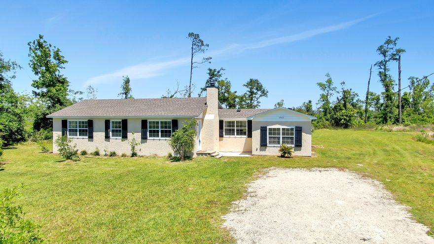 'CURRENTLY UNDER CONTRACT, SELLER ACCEPTING BACKUP OFFERS' If you long for the privacy and space of the country but need the convenience of living in town this is the home for you! This charming cottage home was completely rebuilt after the hurricane and is better than ever. The roof and the AC were both replaced, and the flooring, fixtures, and kitchen appliances are all new as well. This home has a wonderful split floor plan, and it even has an office/bonus room. With almost 2 acres and a large storage shed out back, you'll love the outside space. The zoning of this property also allows for horses. Make sure you check this one out today!! All measurements are approximate. Please verify if important.