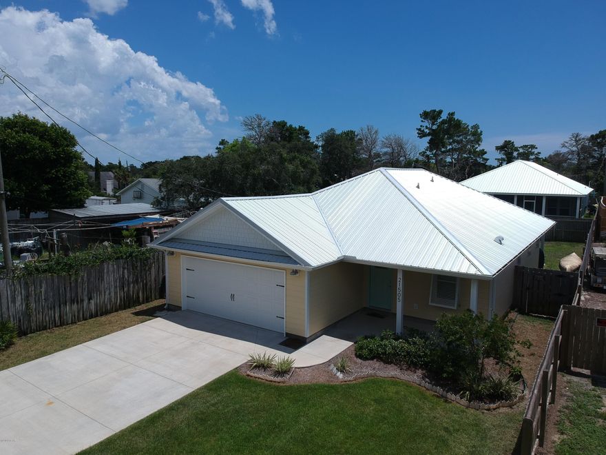 I know you are looking for a unique, almost brand new, home in the west end of the beach !!  Well you found it. Not only is the location awesome,  but the home is loaded with features !!  Located SOUTH of back beach rd. You can ride your golf cart down the street to the beaches area. Meet up with your neighbors for a group meet or ride. Take your fishing gear for some great surf fishing !! What a great place to live !!  Enjoy the neighborhood living in this awesome 3 br  2 ba home with a double car garage.  The list of features is quite lengthy. Just a sample: >>>CLICK MORE>>> Custom built, clear hurricane shutters; whole house de-humidifer; custom built closet shelves; custom built blinds; stainless steel appliances, washer and dryer, these are just